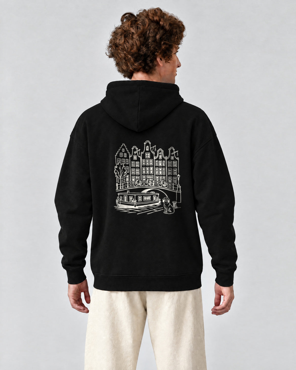 Amsterdam Chapter Hoodie - Black on a model, from behind