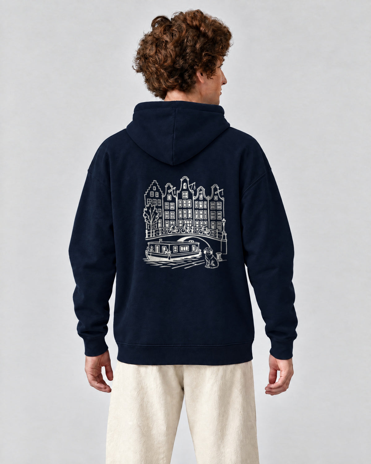 Amsterdam Chapter Hoodie - Navy on a model, from behind