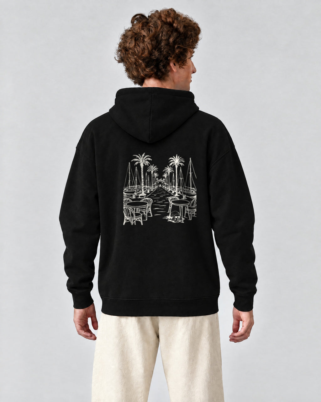 Marbella Chapter Hoodie - Black on a model, from behind