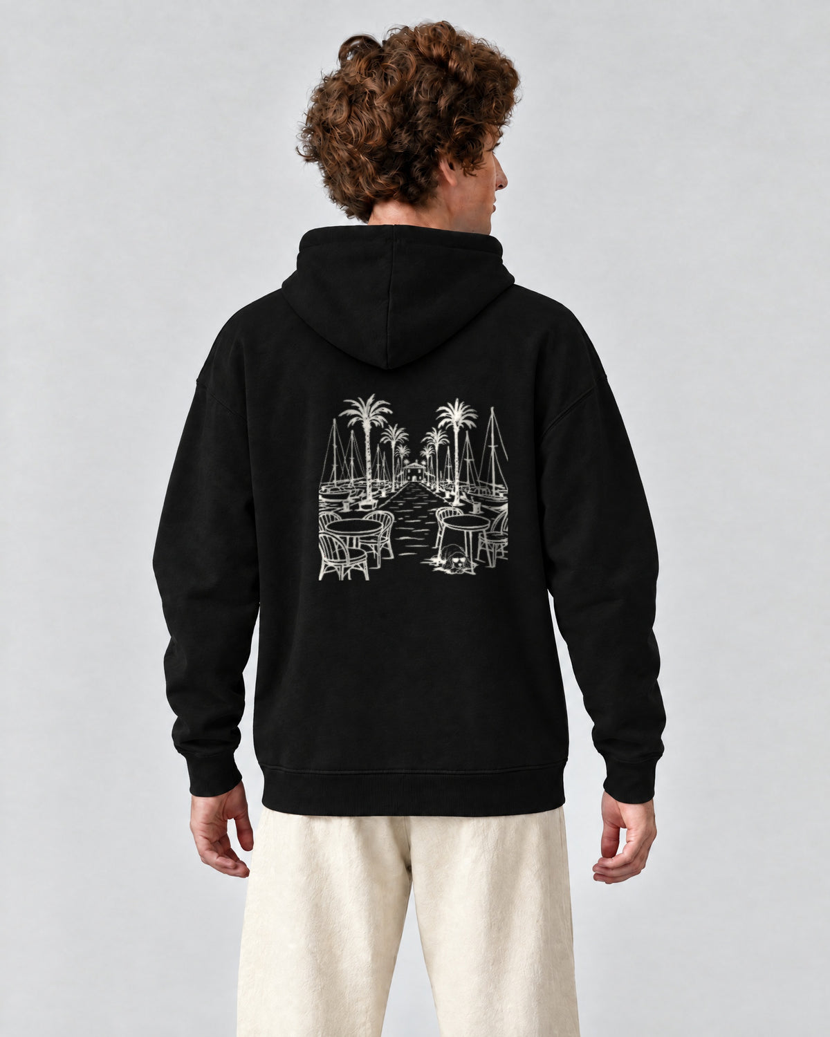Marbella Chapter Hoodie - Black on a model, from behind