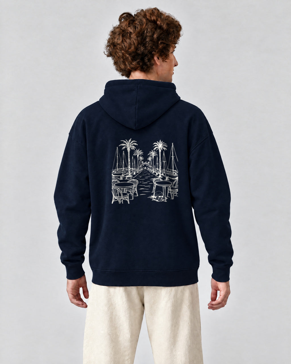 Marbella Chapter Hoodie - Navy on a model, from behind