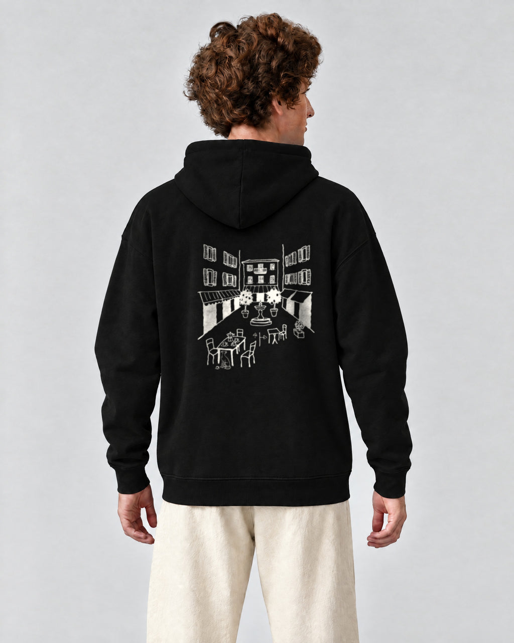 Milano Chapter Hoodie - Black on a model, from behind