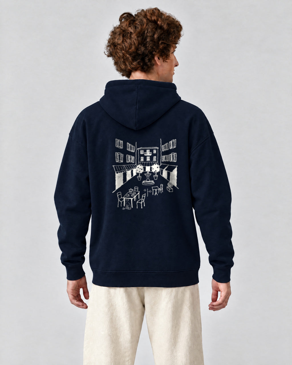 Milano Chapter Hoodie - Navy on a model, from behind