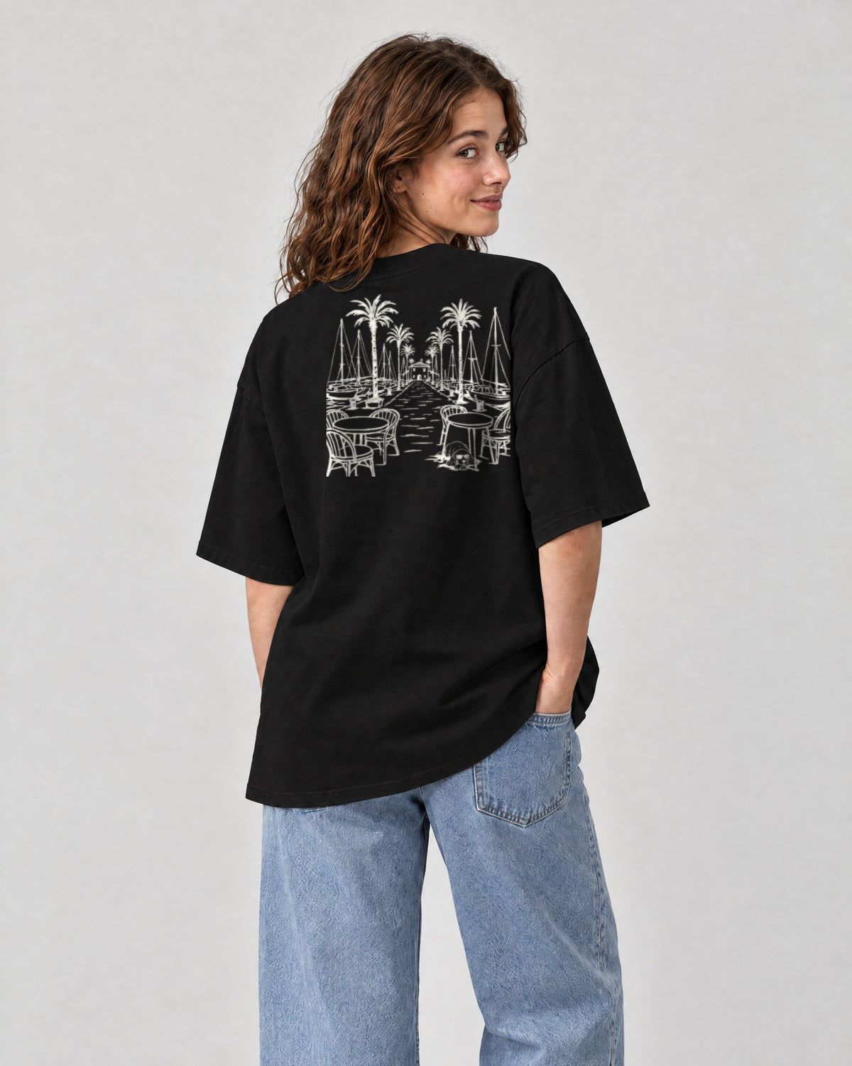 Marbella Chapter Tee - Black on a model, from behind