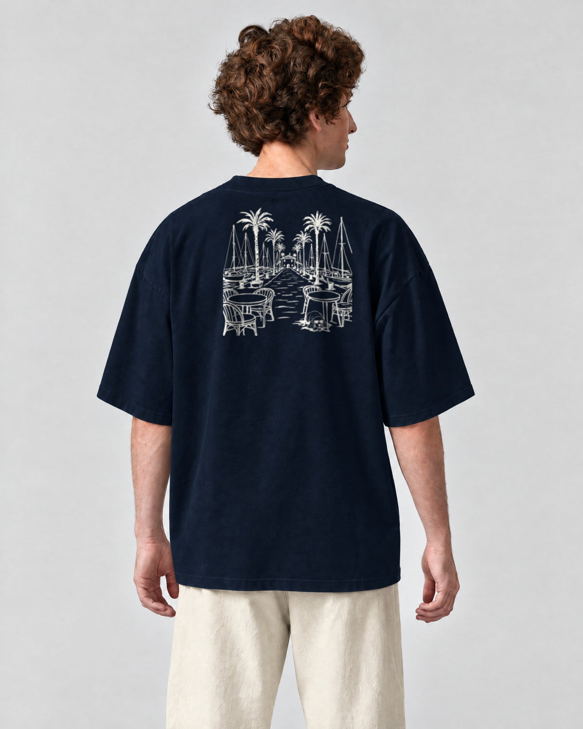 Marbella Chapter Tee - Navy on a model, from behind