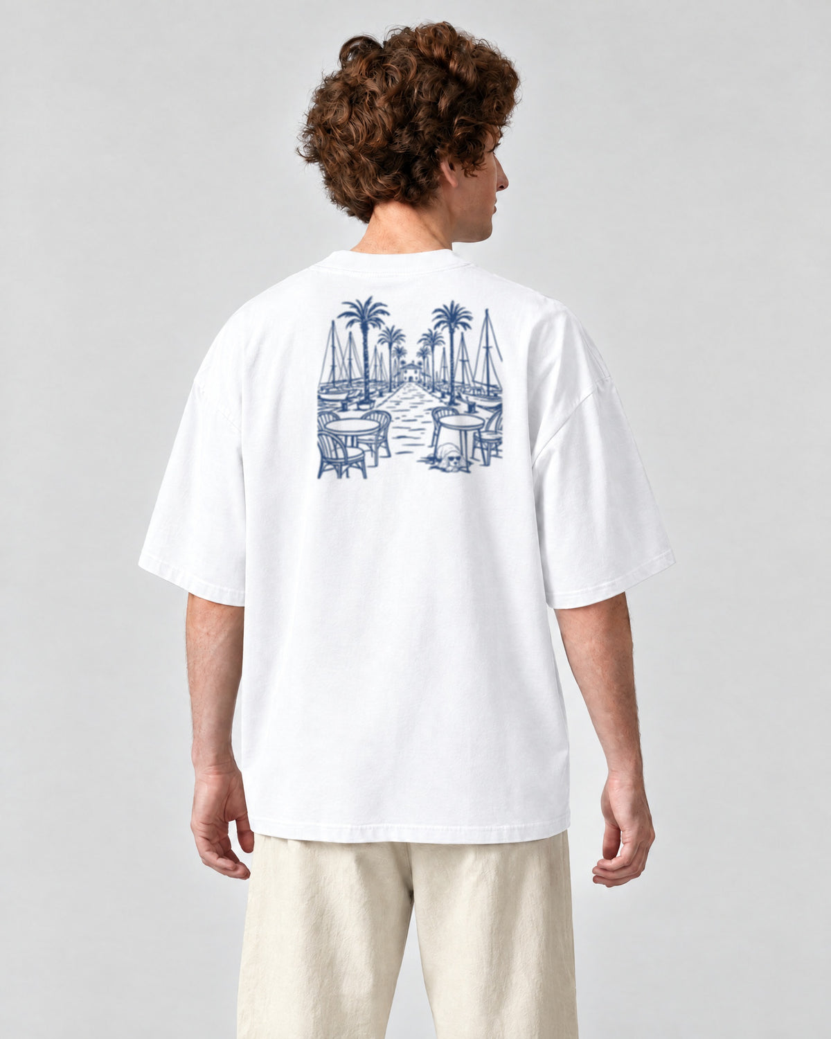Marbella Chapter Tee - White on a model, from behind