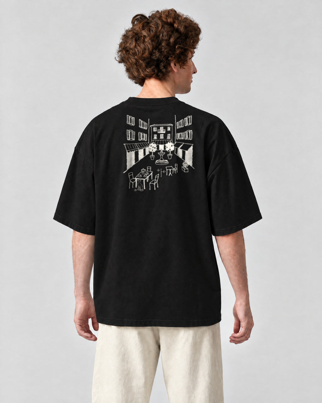 Milano Chapter Tee - Black on a model, from behind