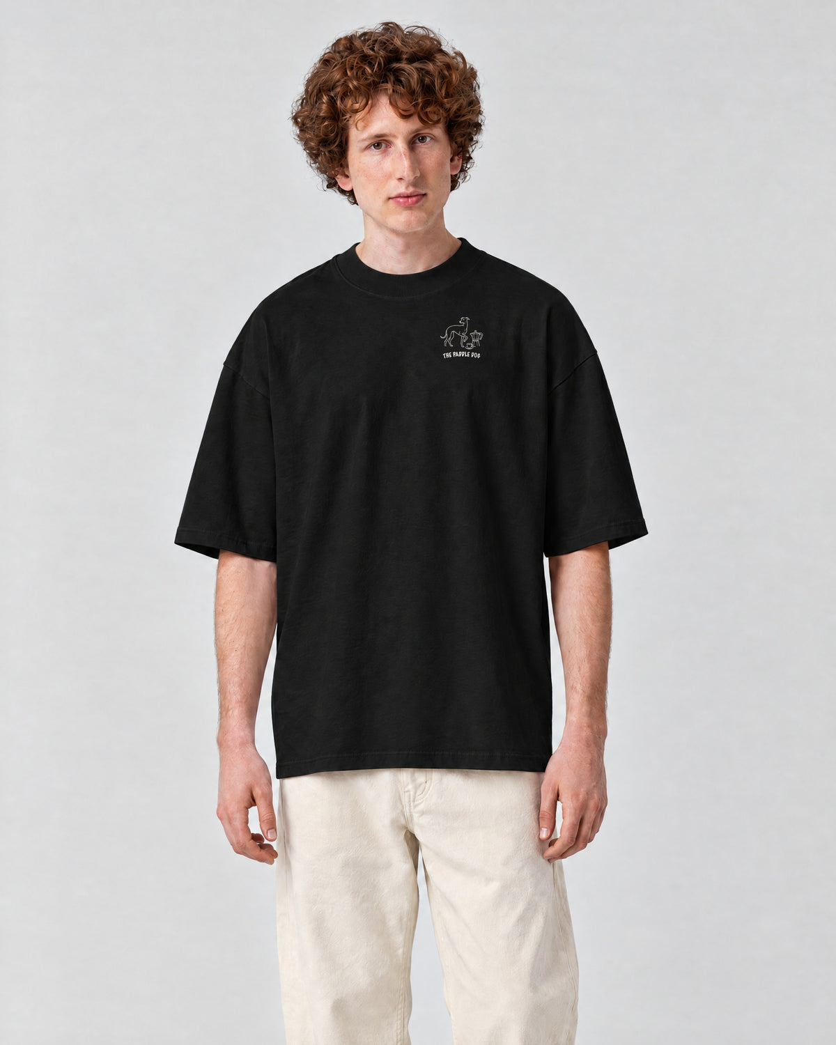 Milano Chapter Tee - Black on a model, from the front