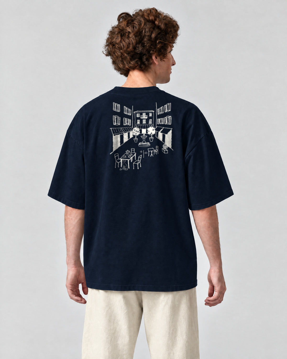 Milano Chapter Tee - Navy on a model, from behind