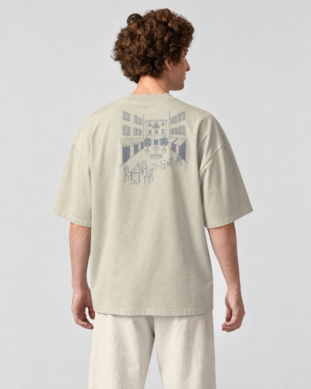 Milano Chapter Tee - Stone on a model, from behind