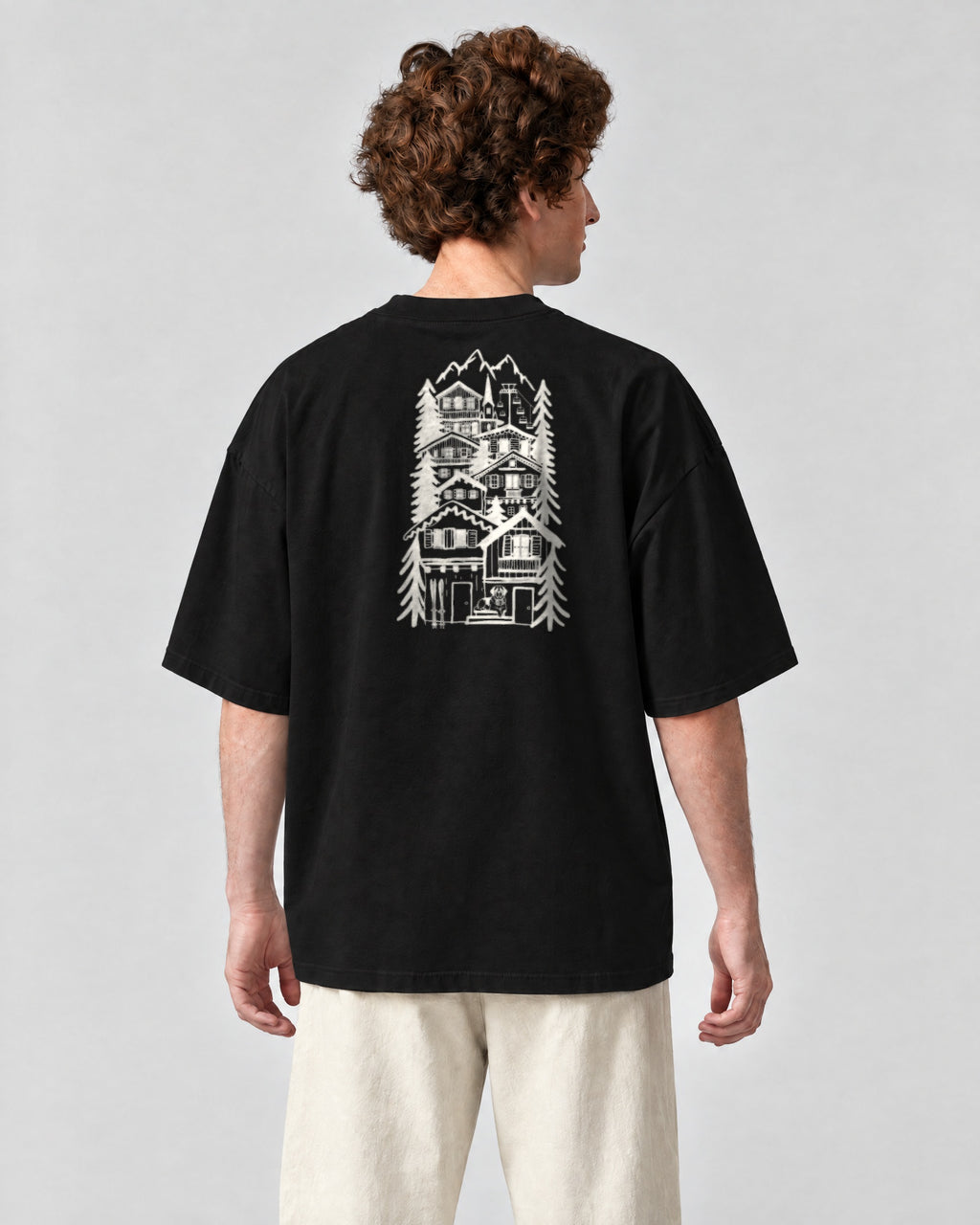 St Moritz Chapter Tee - Black on a model, from behind