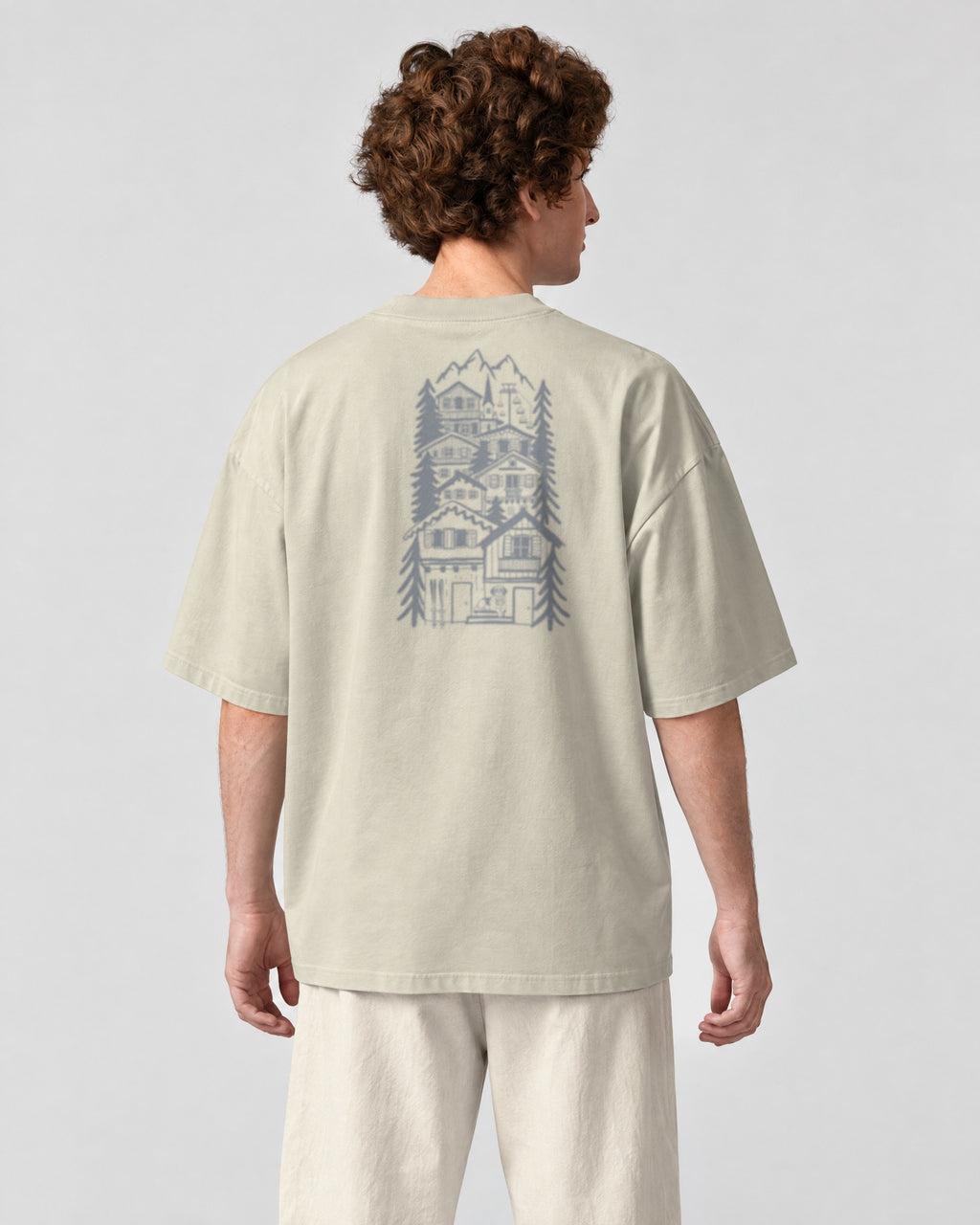 St Moritz Chapter Tee - Stone on a model, from behind
