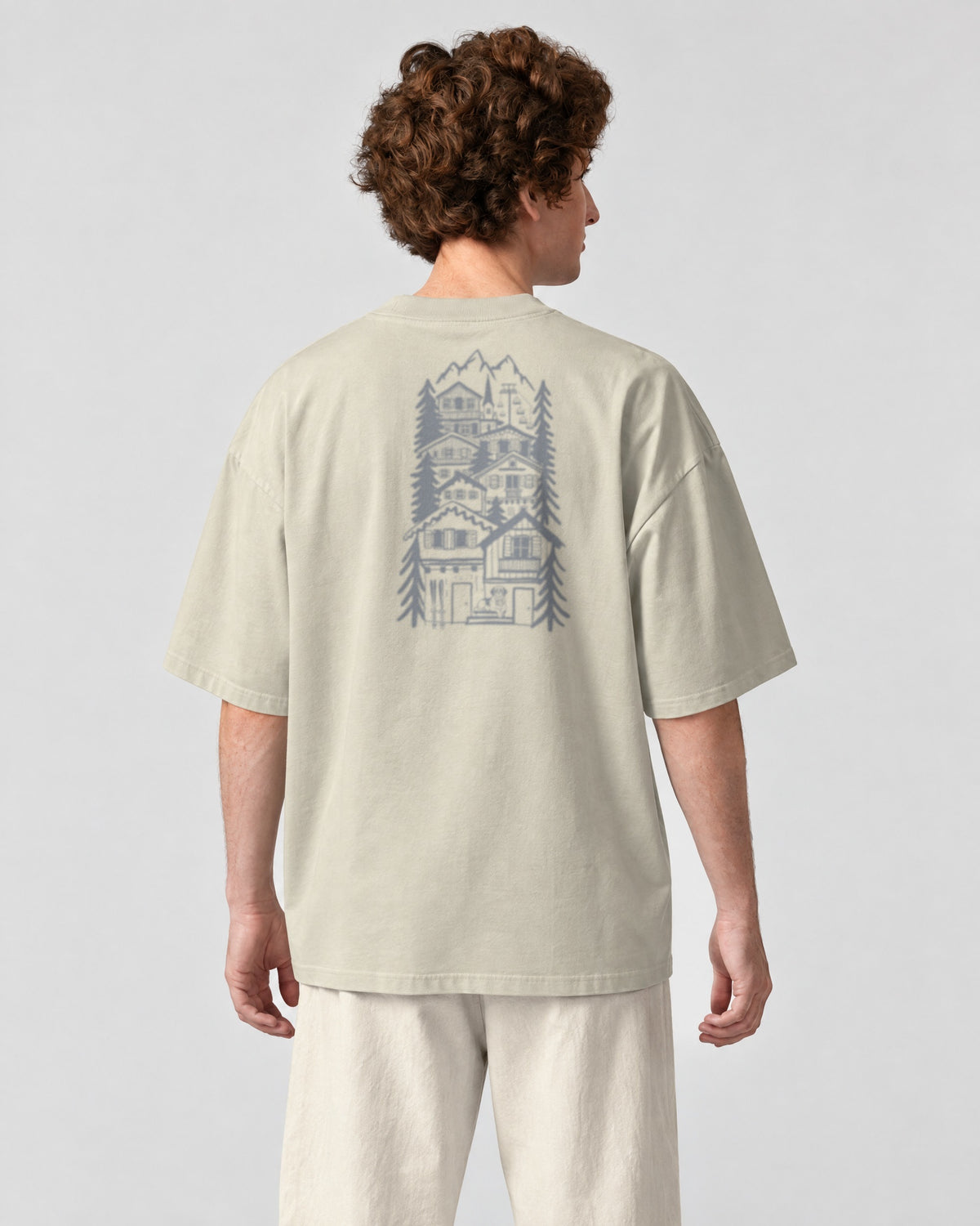St Moritz Chapter Tee - Stone on a model, from behind